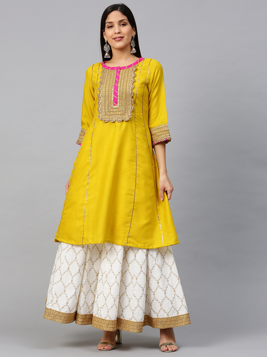 

Bhama Couture Women Mustard & White Gotta Patti Striped Kurta with Block Printed Skirt