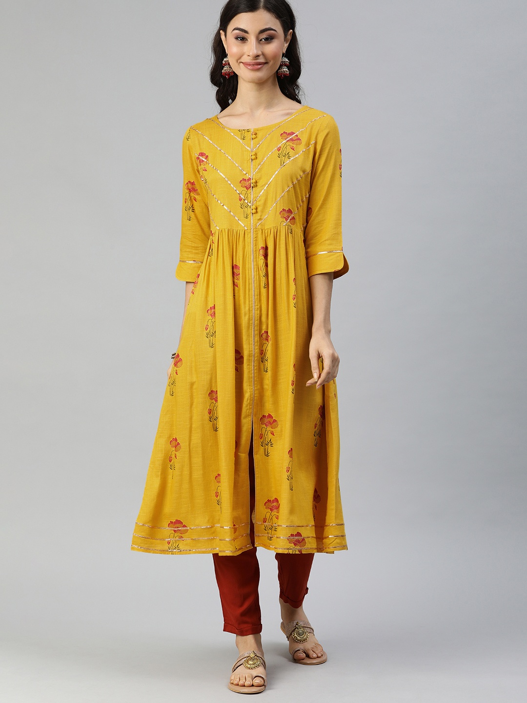 

Alena Women Mustard Yellow & Red Floral Printed Pleated A-Line Kurta With Gotta Patti Work