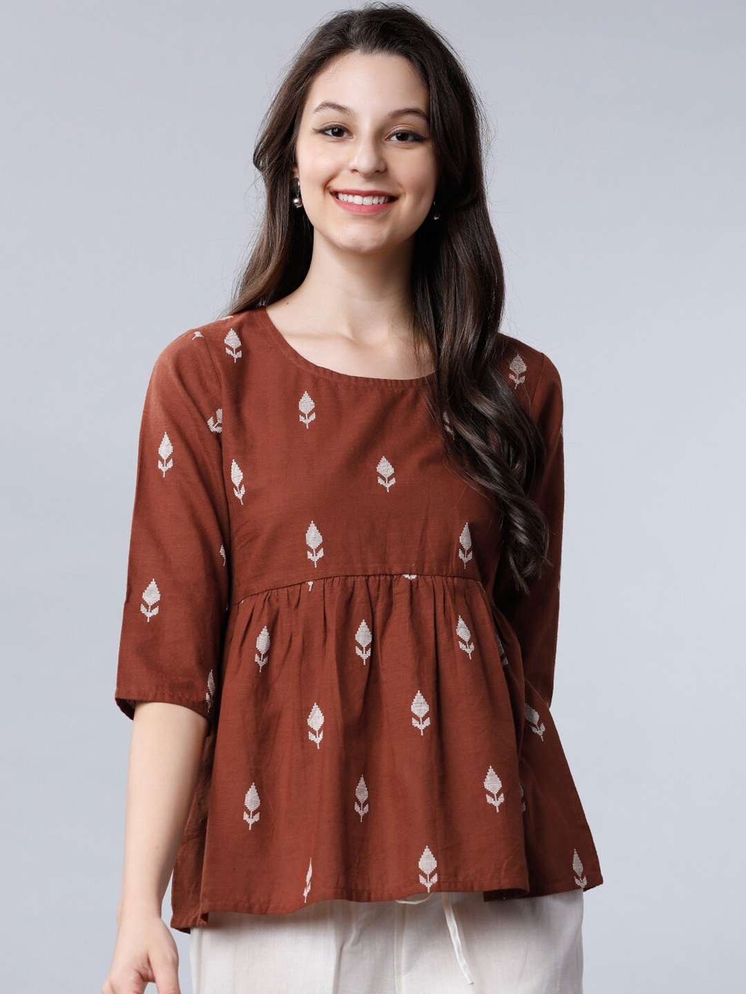 

Vishudh Brown Embroidered Empire Top