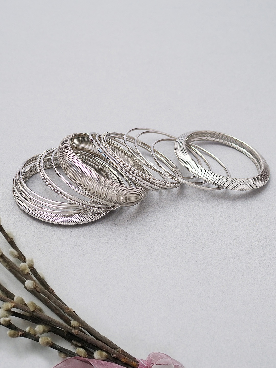 

Golden Peacock Women Set of 17 Oxidised Silver-Plated Bangles