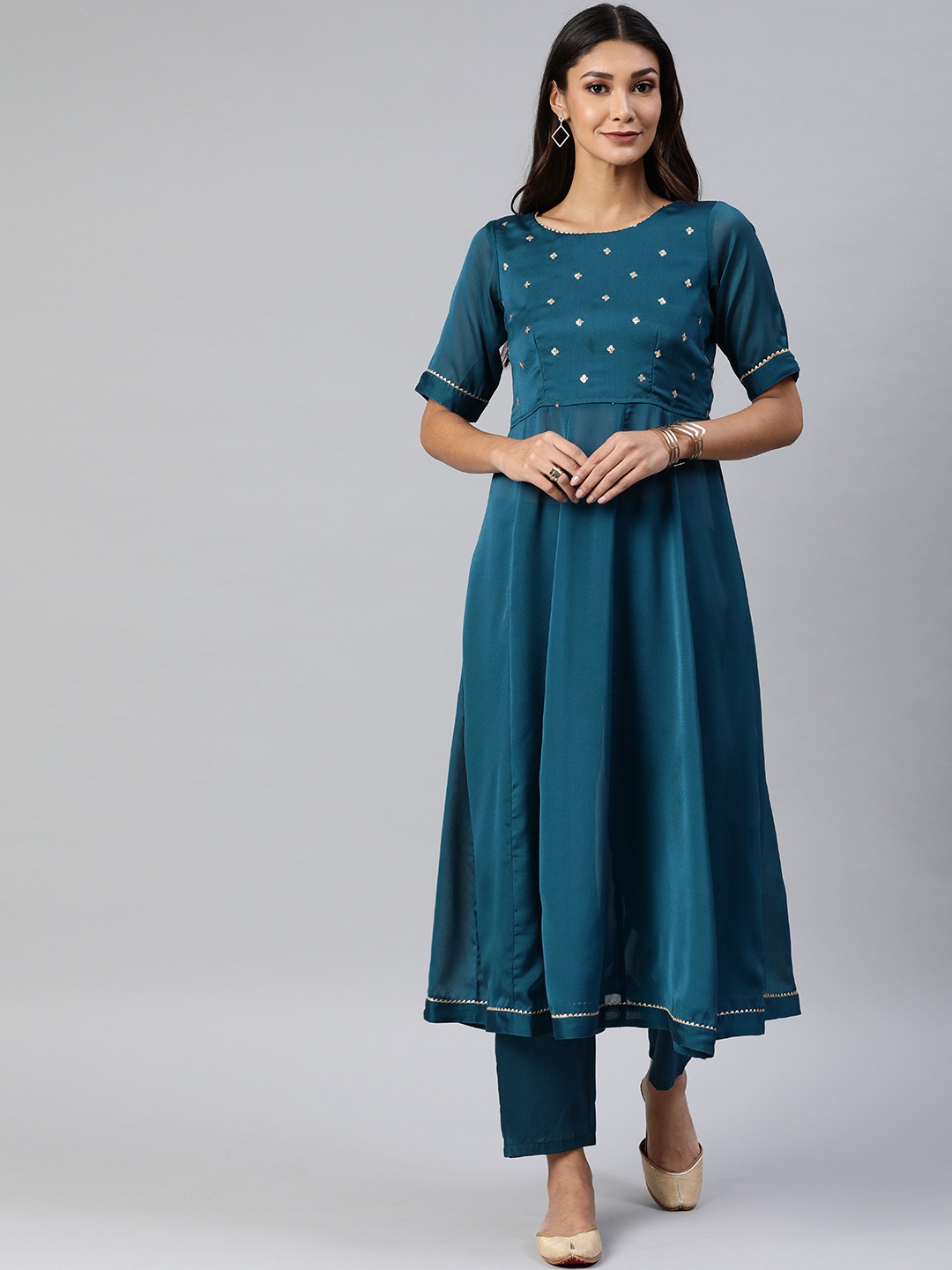 

Inddus Women Green Solid Kurta with Trousers