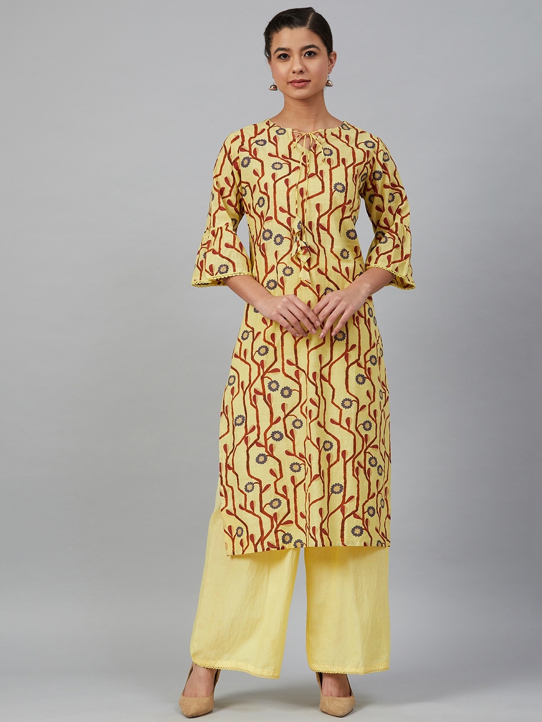 

Meeranshi Women Yellow & Rust Brown Screen Printed Kurta with Palazzos