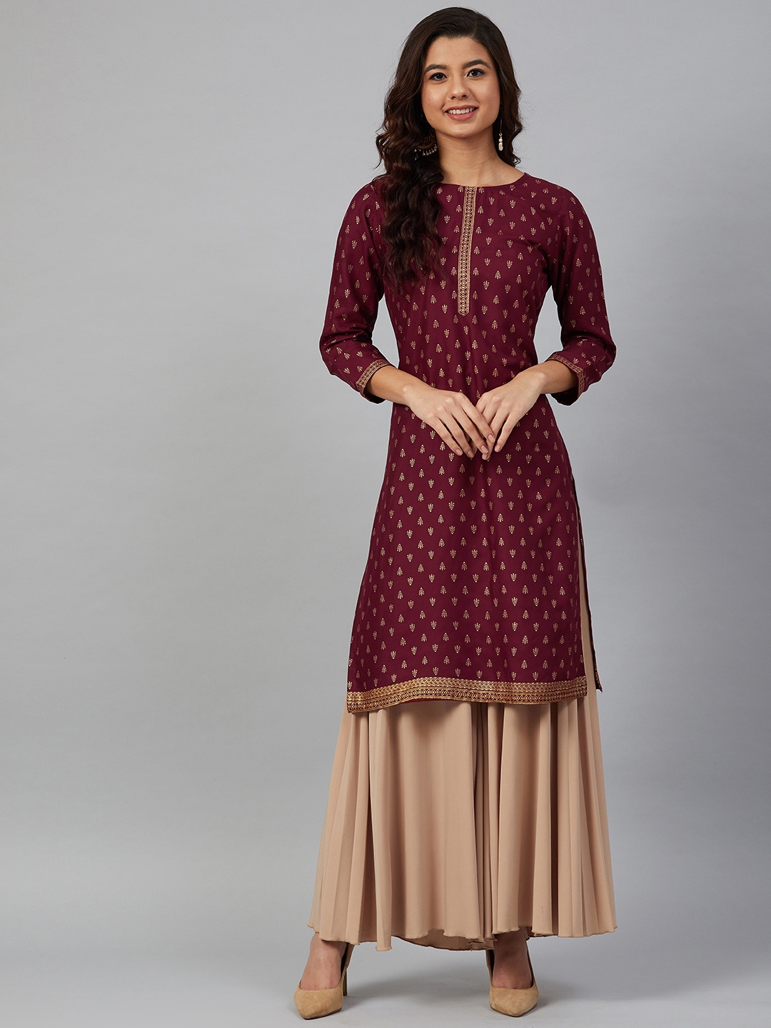 

Meeranshi Women Maroon & Golden Printed Straight Kurta