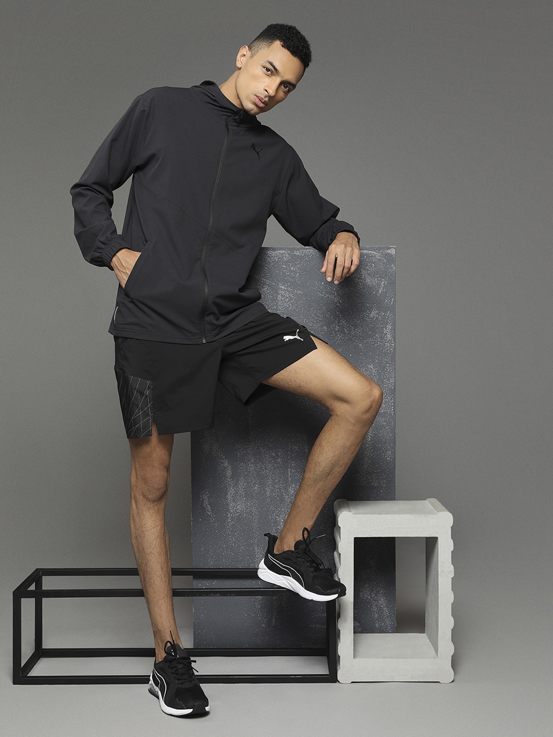 

Puma Men Black & White Printed Regular Fit Sports Shorts