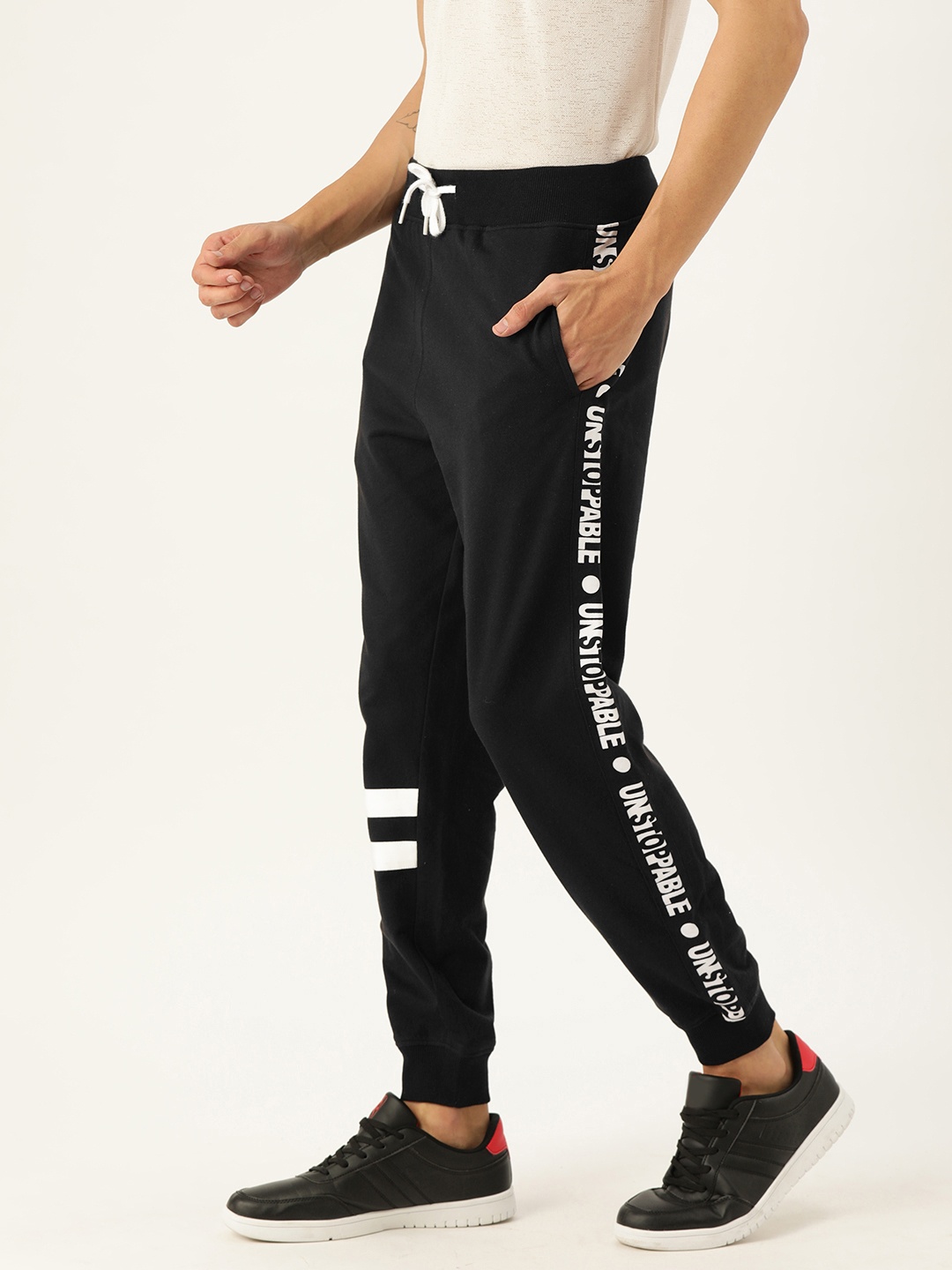 

VEIRDO Men Black Solid Regular Fit Joggers With Printed Side Stripes
