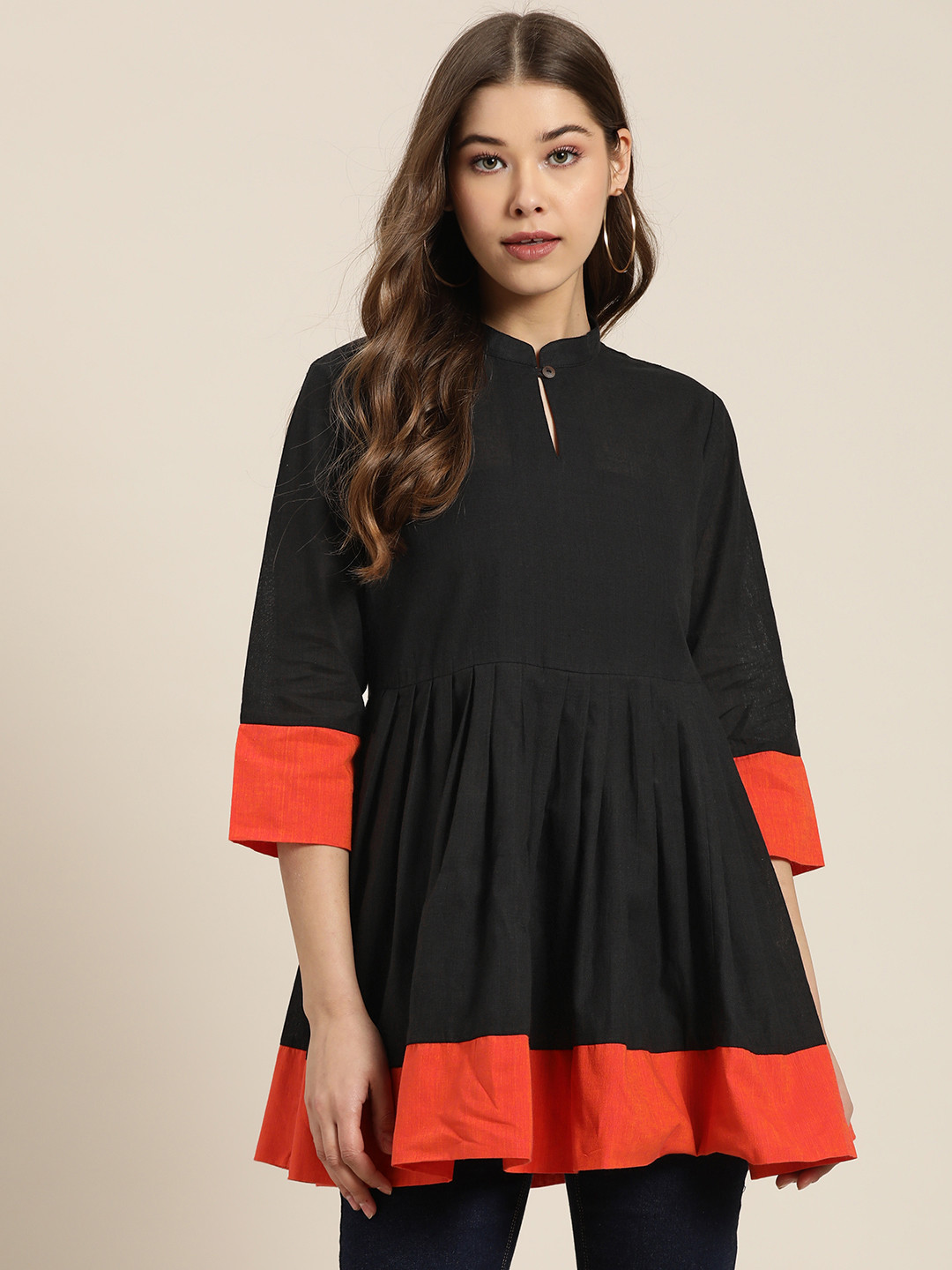 

Sangria Women Black and Coral Orange Solid Pure Cotton Longline A-Line Top