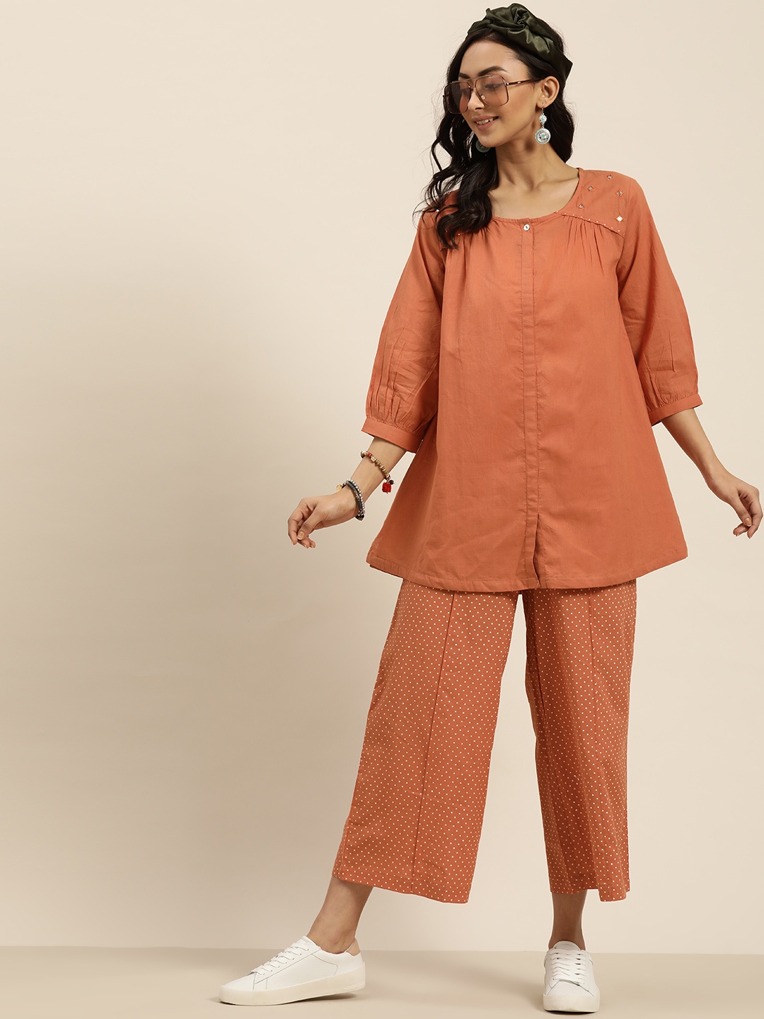 

Sangria Women Rust Orange Embroidered Detail A-Line Kurti with Polka Dot Print Palazzos