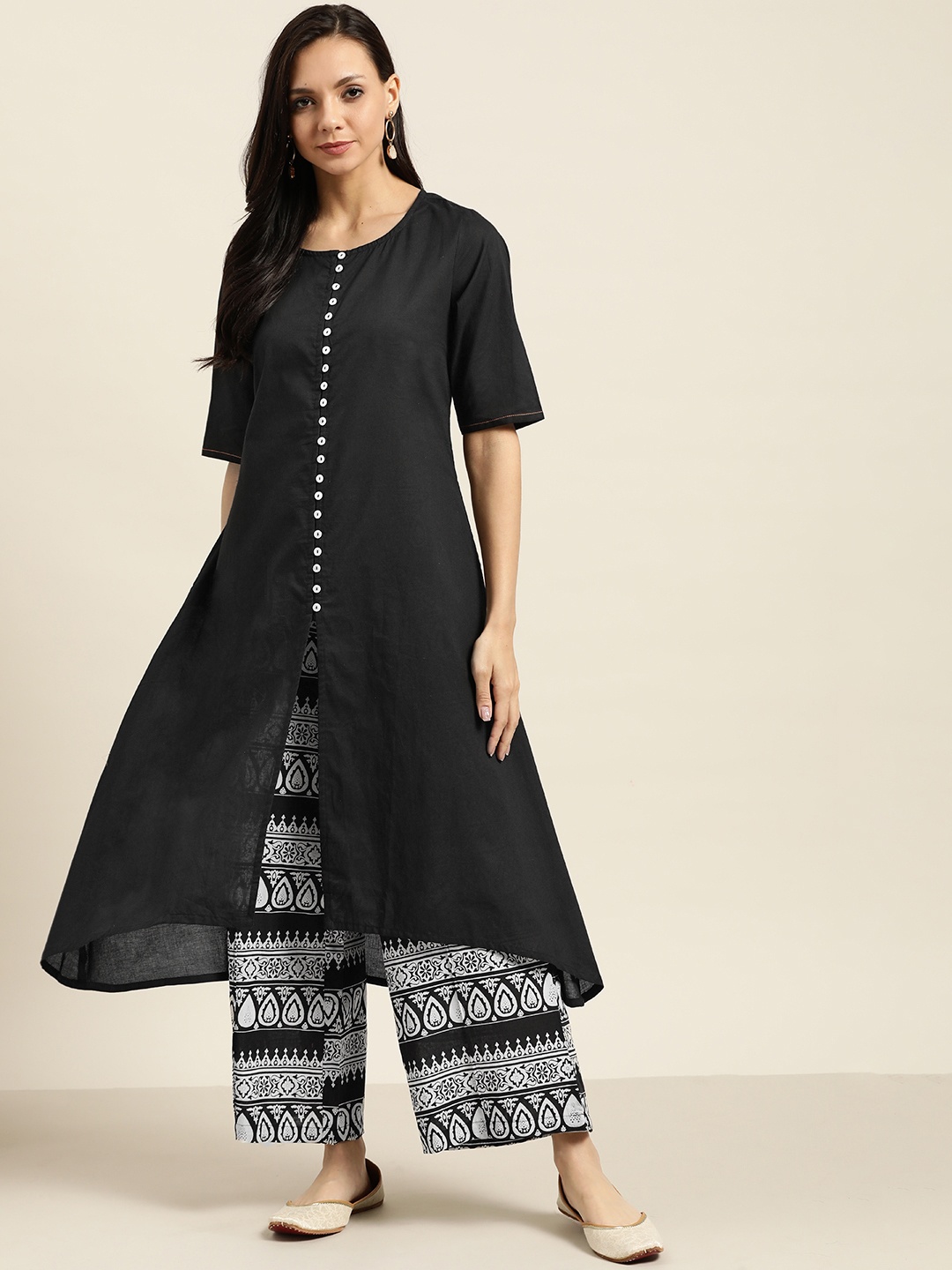 

Sangria Women Black & White Solid Cotton Kurta with Palazzos
