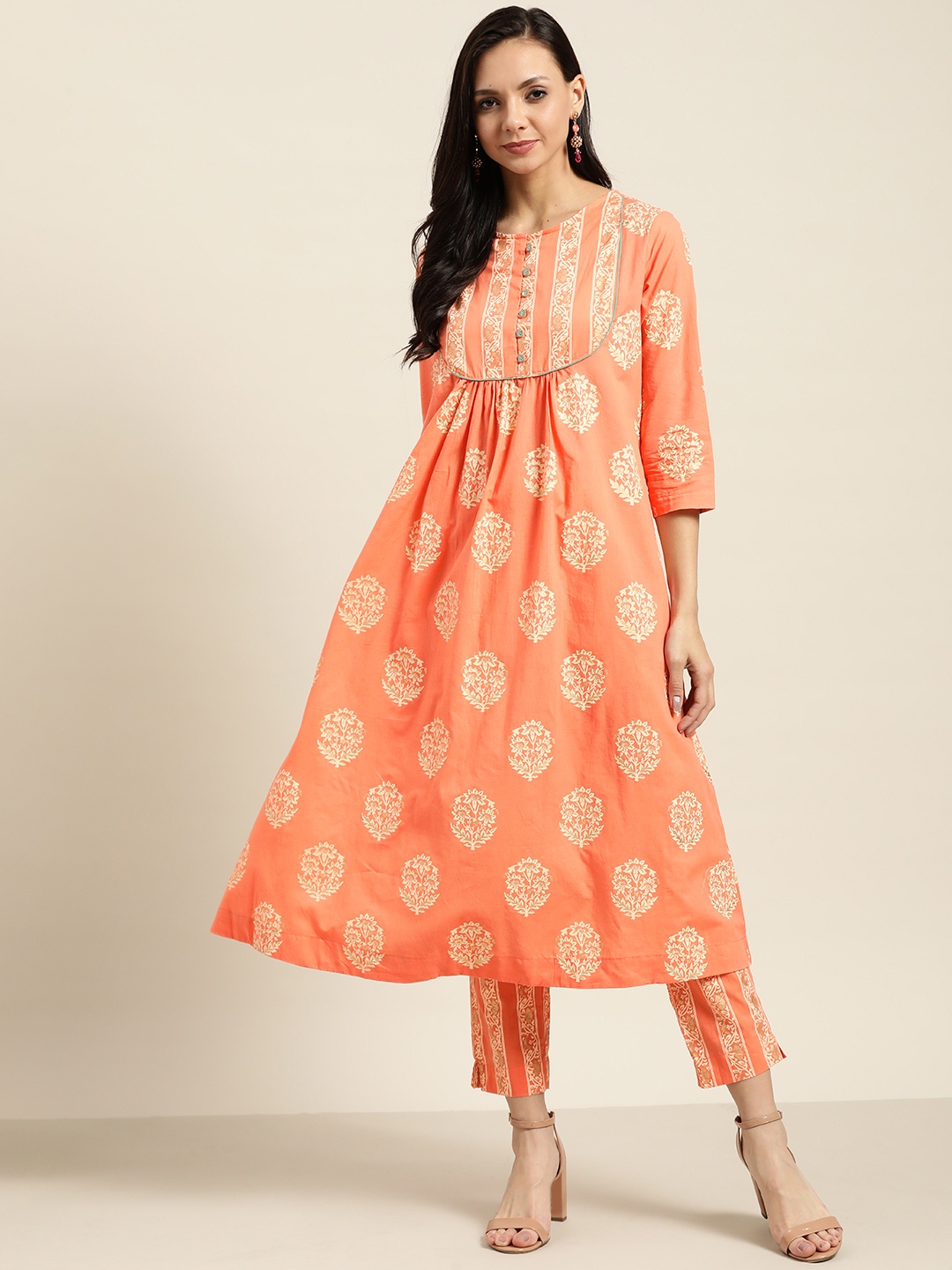 

Sangria Women Peach-Coloured & Cream-Coloured Printed Cotton Kurta with Trousers