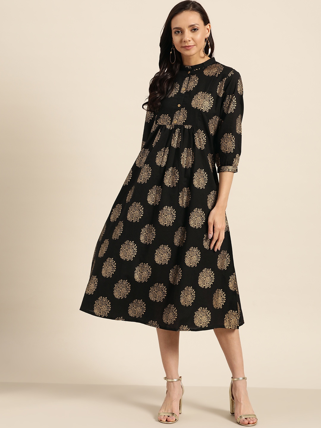 

Sangria Women Black & Golden Printed A-Line Dress