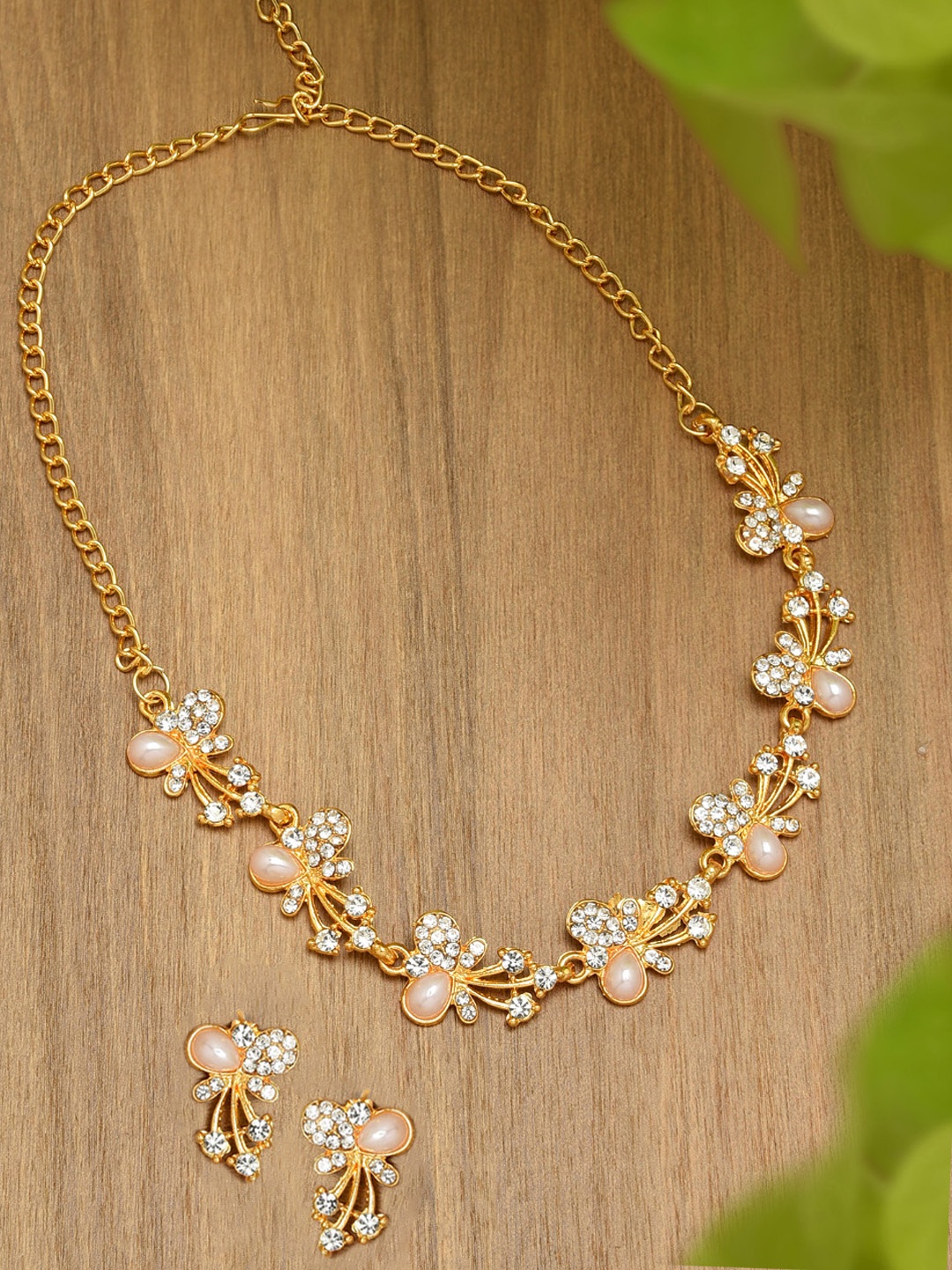 

Zaveri Pearls Gold-Toned Austrian Diamonds Jewellery Set