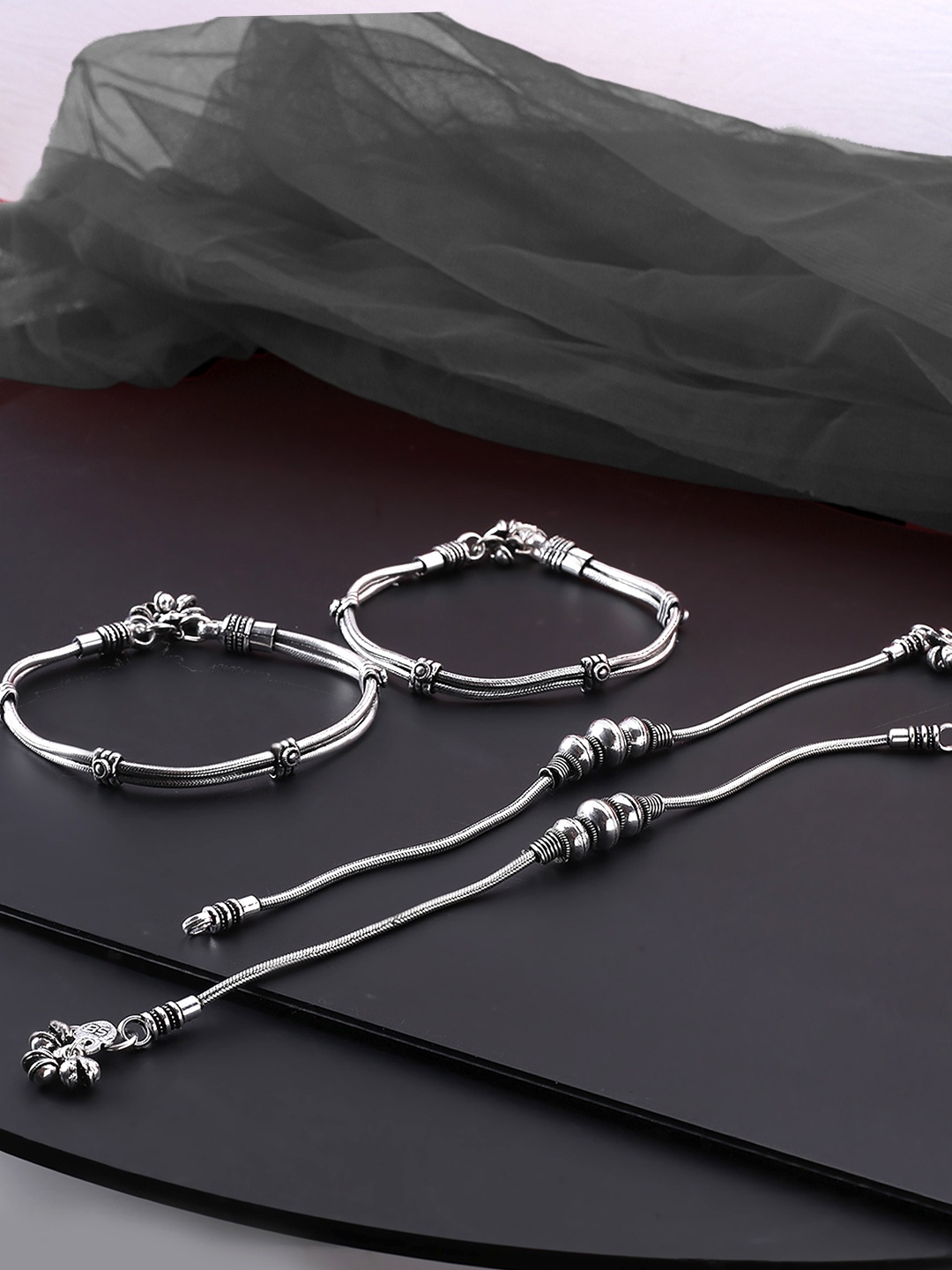 

Yellow Chimes Set Of 4 Silver-Toned Oxidized Brass-Plated Anklets
