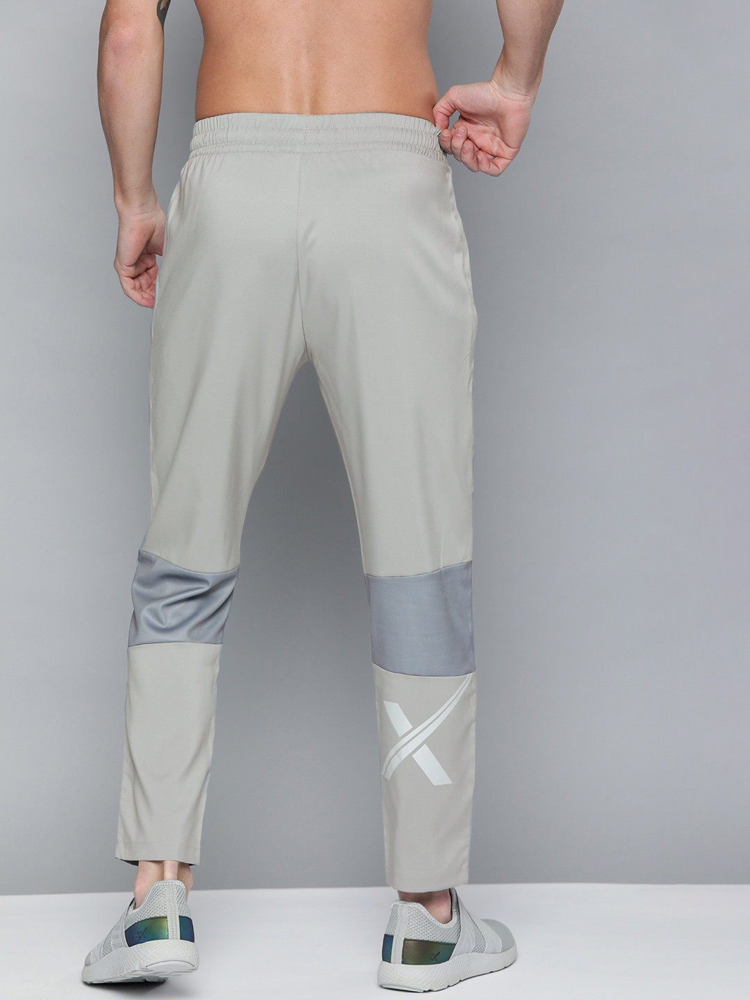 

HRX by Hrithik Roshan Men Grey Solid Running Track Pants with Striped Detailing