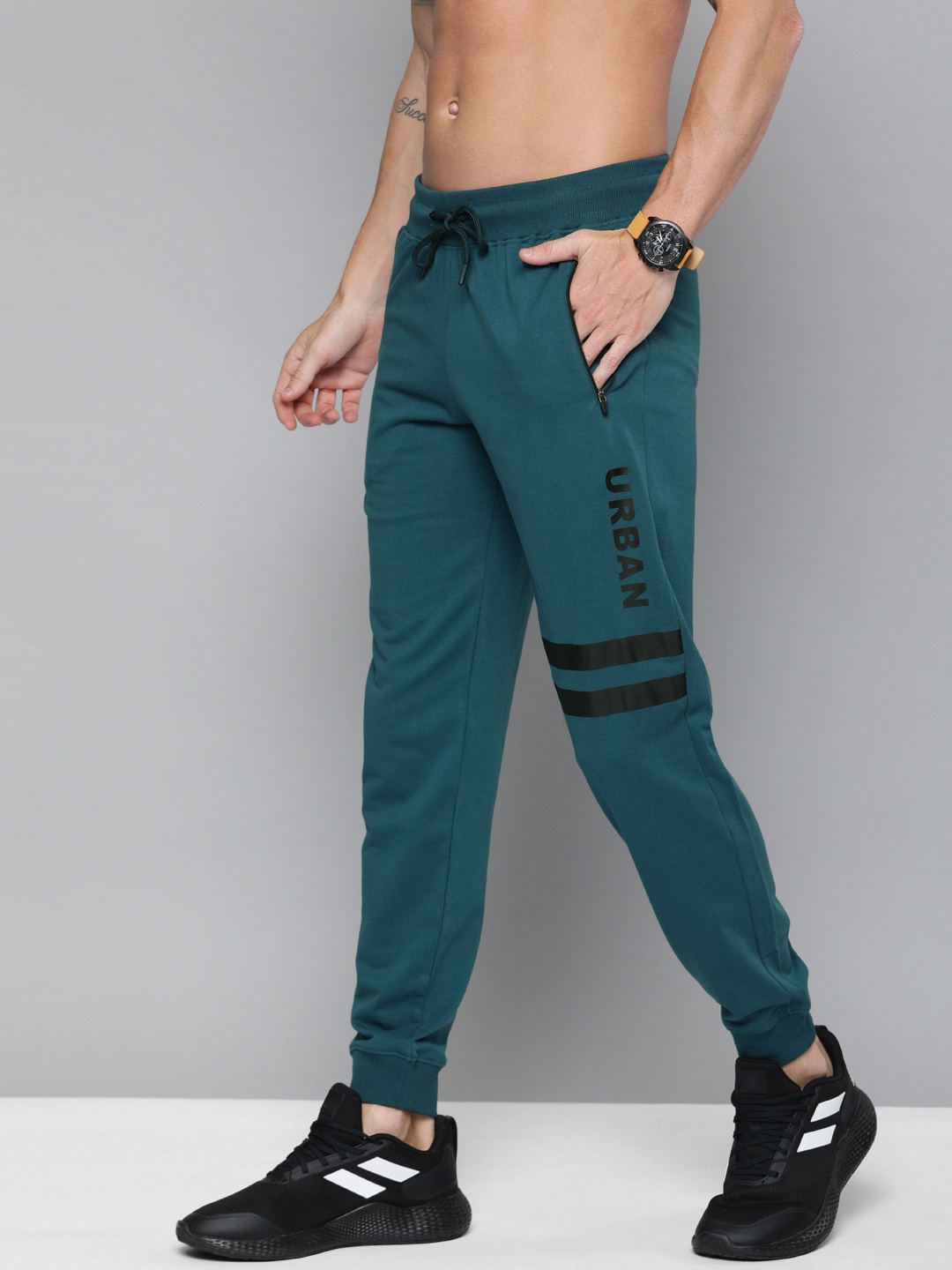 

HERE&NOW Men Teal Blue Solid Joggers with Striped Detail