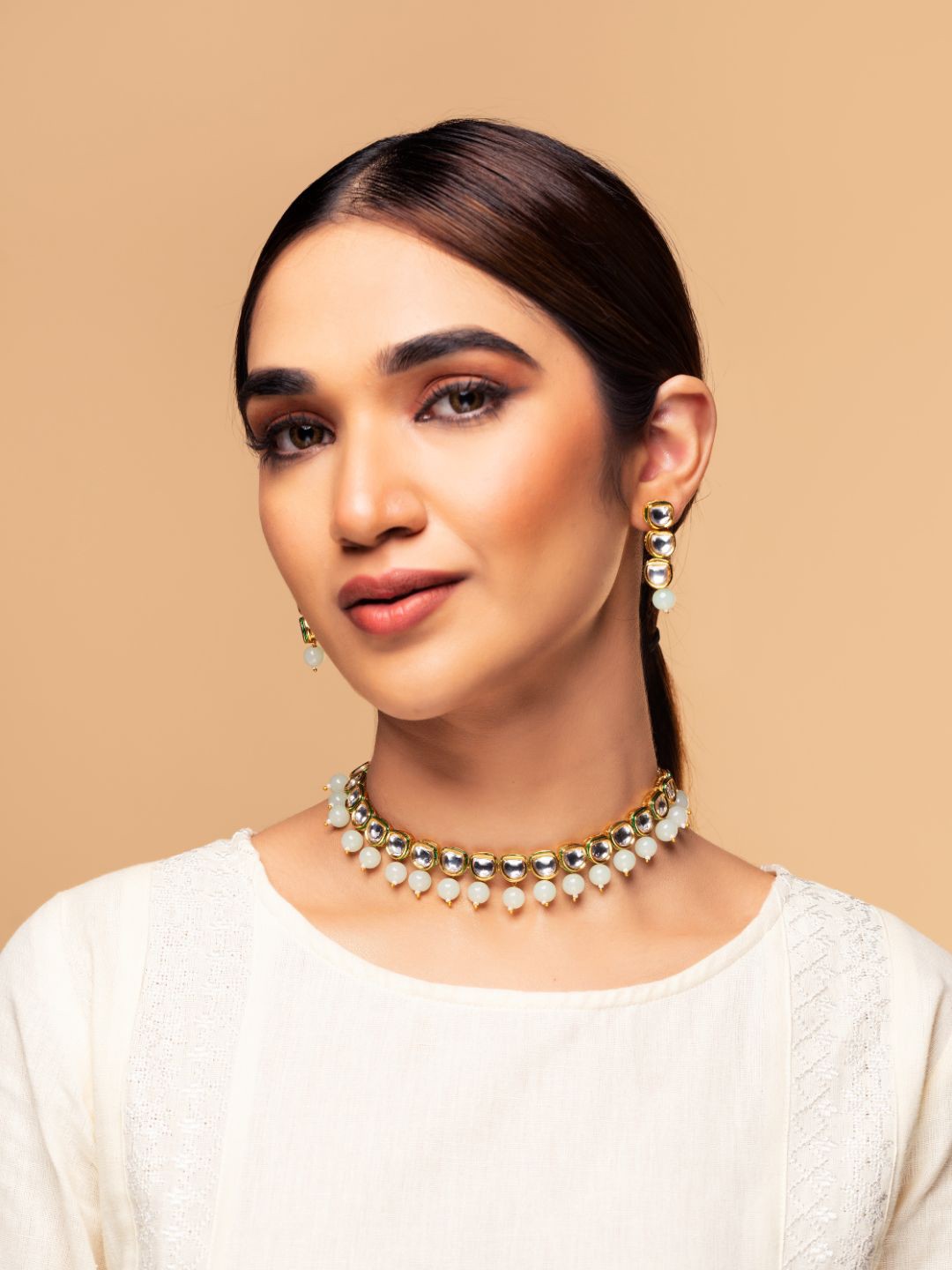 

Priyaasi Off-White Gold-Plated Kundan Studded & Beaded Handcrafted Jewellery Set