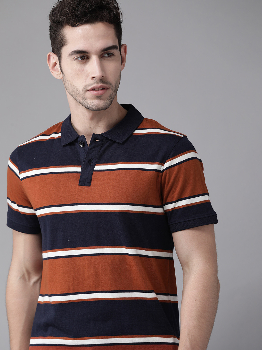 

Roadster Men Navy Blue & Rust Orange Pure Cotton Striped Polo Collar T-shirt