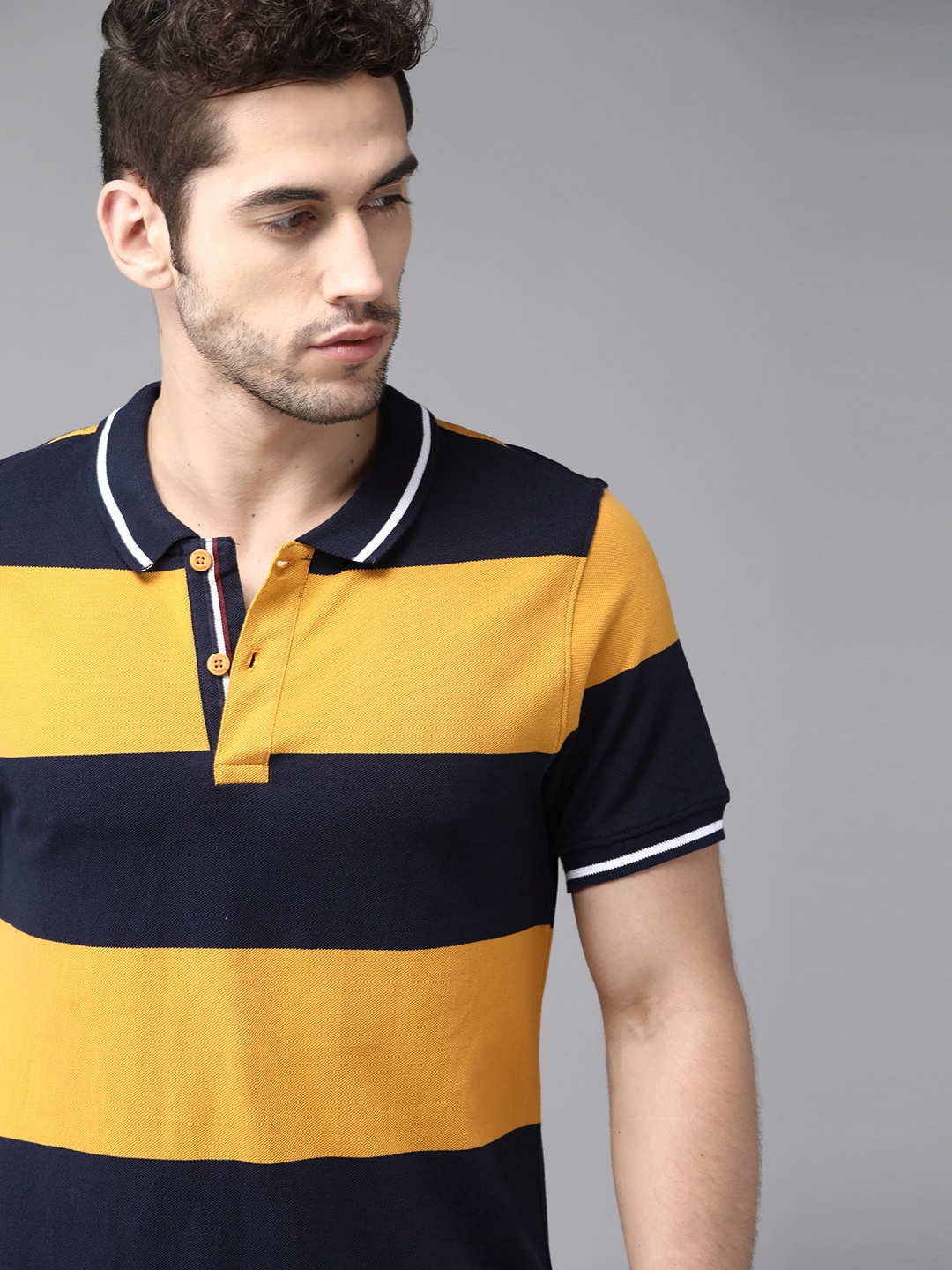

Roadster Men Mustard Yellow & Navy Blue Pure Cotton Striped Polo Collar T-shirt