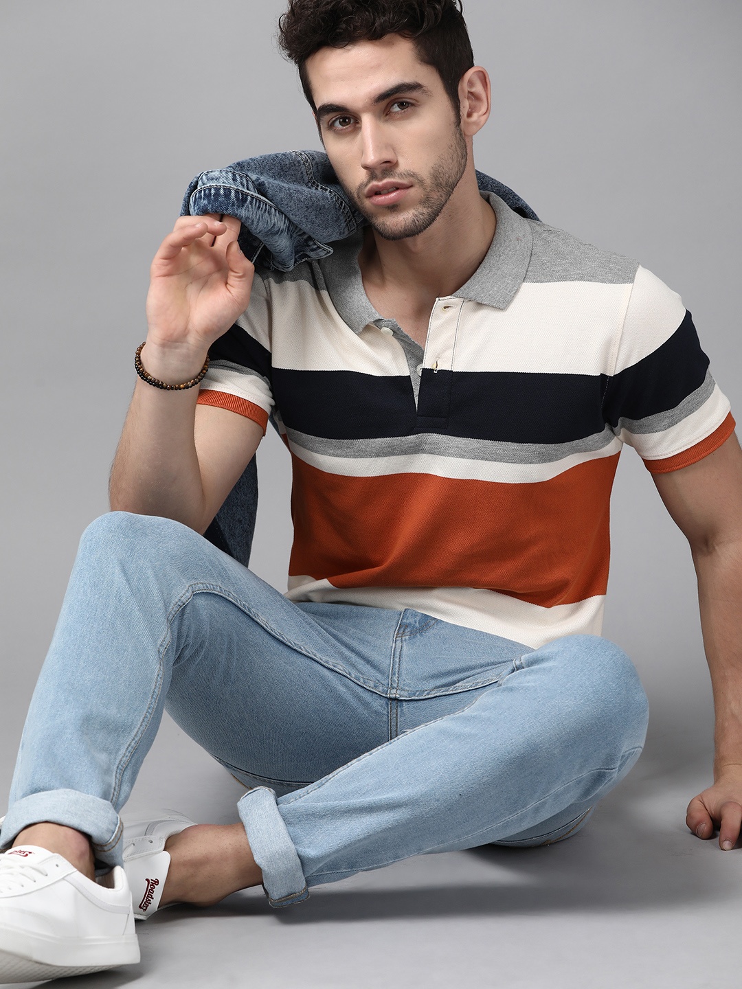 

Roadster Men Off-White & Rust Orange Striped Polo Collar T-shirt