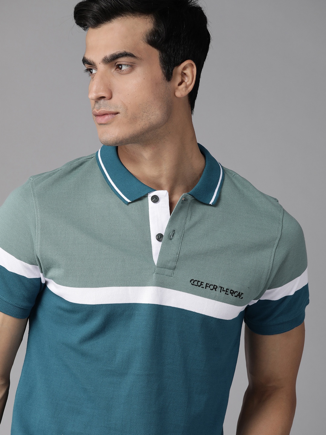 

Roadster Men Teal Blue & White Colourblocked Cotton Polo Collar T-shirt