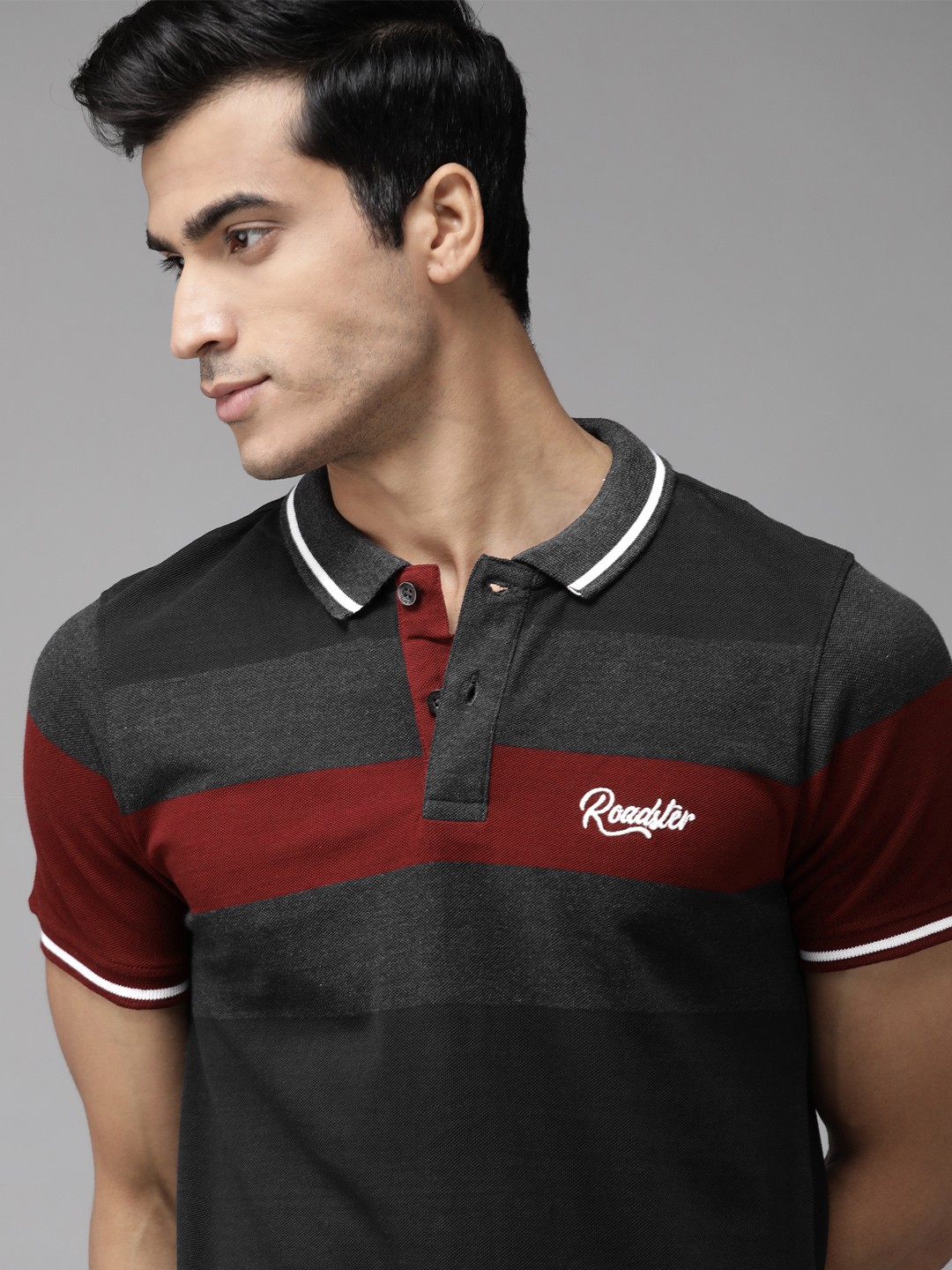 

Roadster Men Black Striped Polo Collar T-shirt