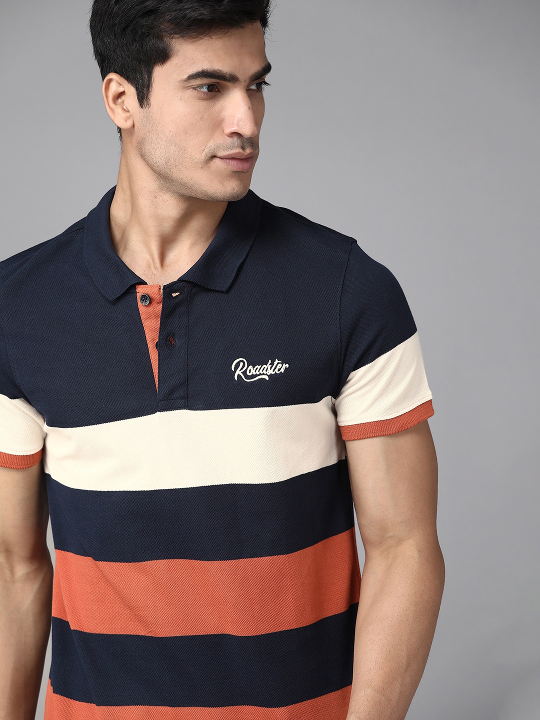 

Roadster Men Navy Blue & Rust Orange Pure Cotton Striped Polo Collar T-shirt