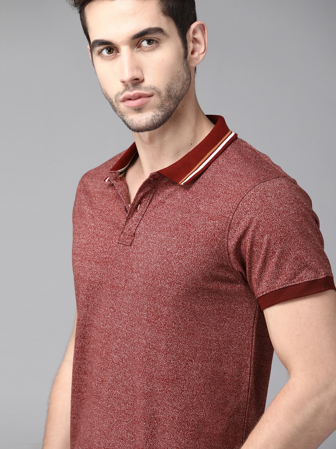 

Roadster Men Maroon Self Design Polo Collar T-shirt