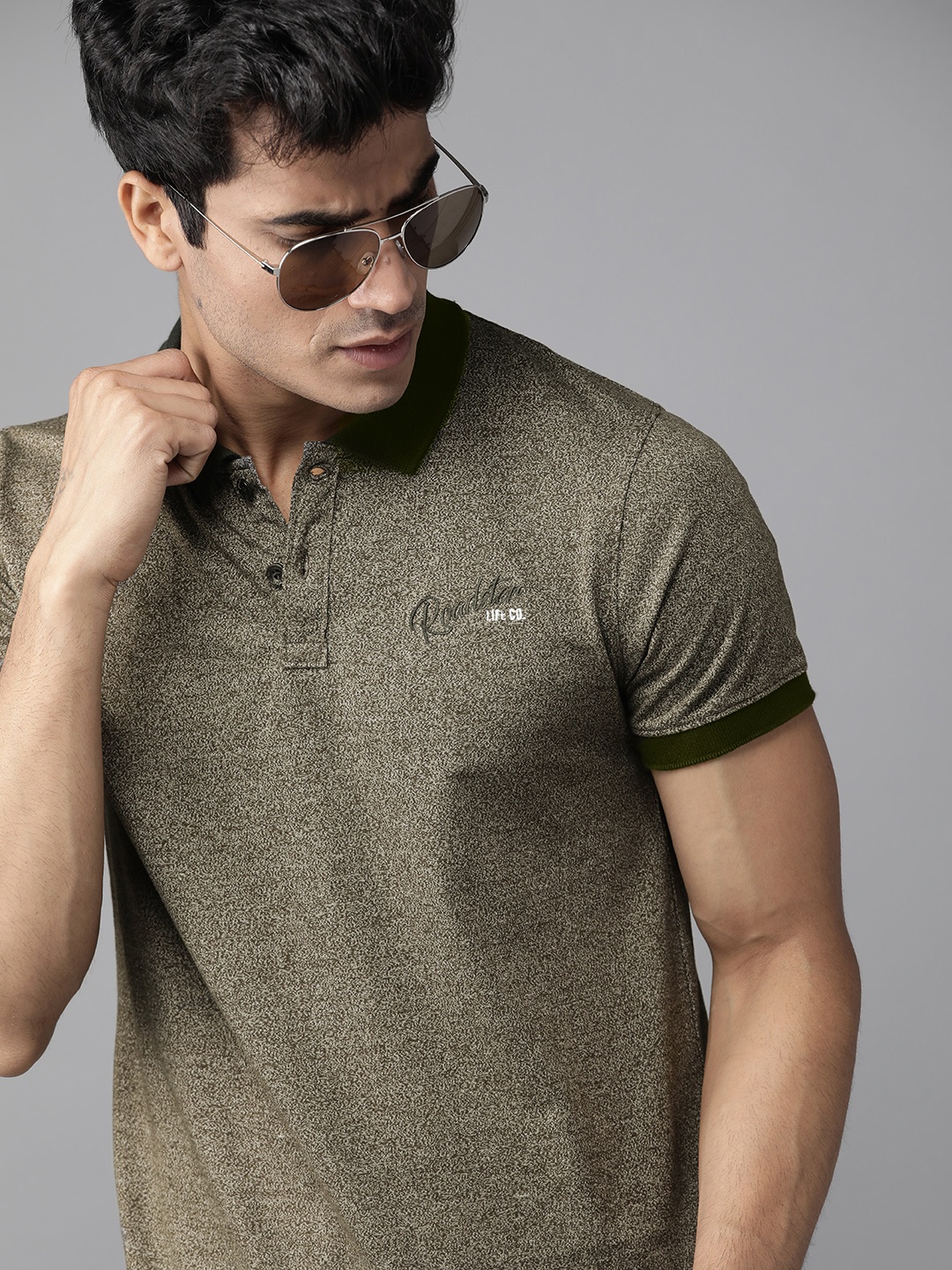 

Roadster Men Olive Green Self Design Polo Collar T-shirt