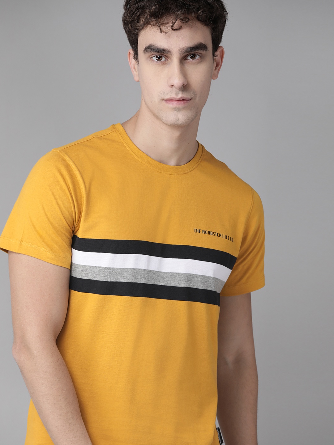 

Roadster Men Mustard Yellow & Black Striped Round Neck T-shirt