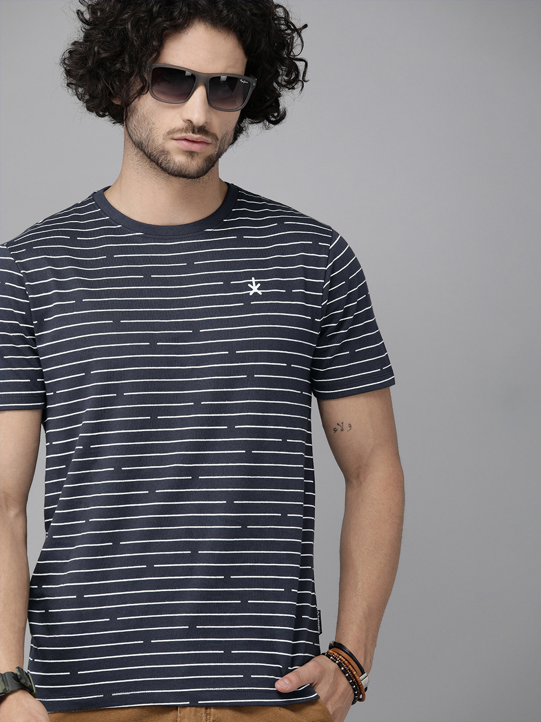 

Roadster Men Navy Blue Striped Round Neck T-shirt