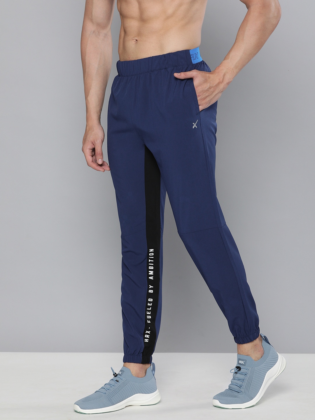 

HRX By Hrithik Roshan Men Jet Black & Estate Blue Typographic Slim Fit Rapid-Dry Antimicrobial Training Joggers, Navy blue