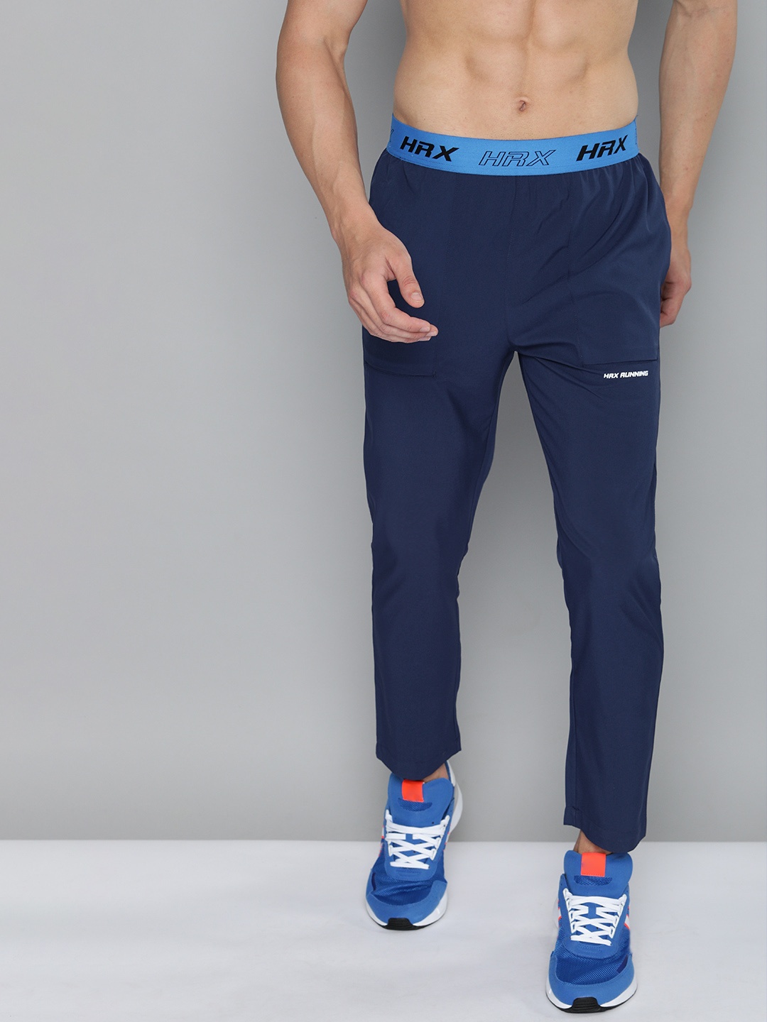 

HRX By Hrithik Roshan Men Estate Blue &Brilliant Blue Typographic Slim Fit Rapid-Dry Antimicrobial Running Track Pants