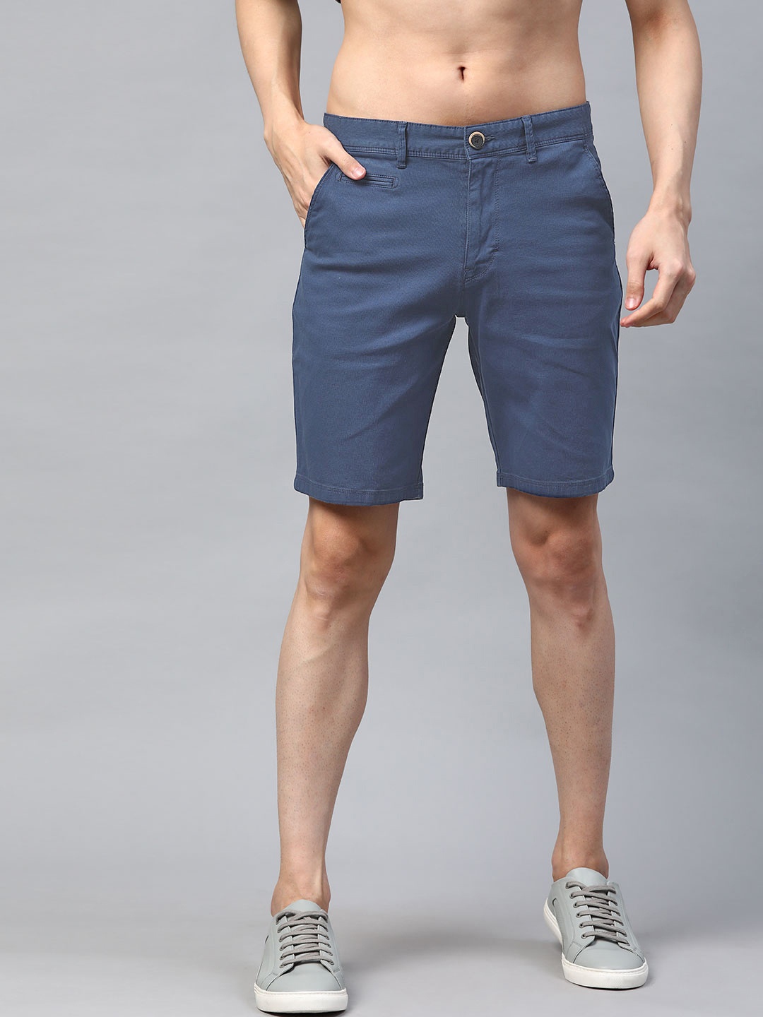 

Roadster Men Blue Solid Mid-Rise Regular Shorts