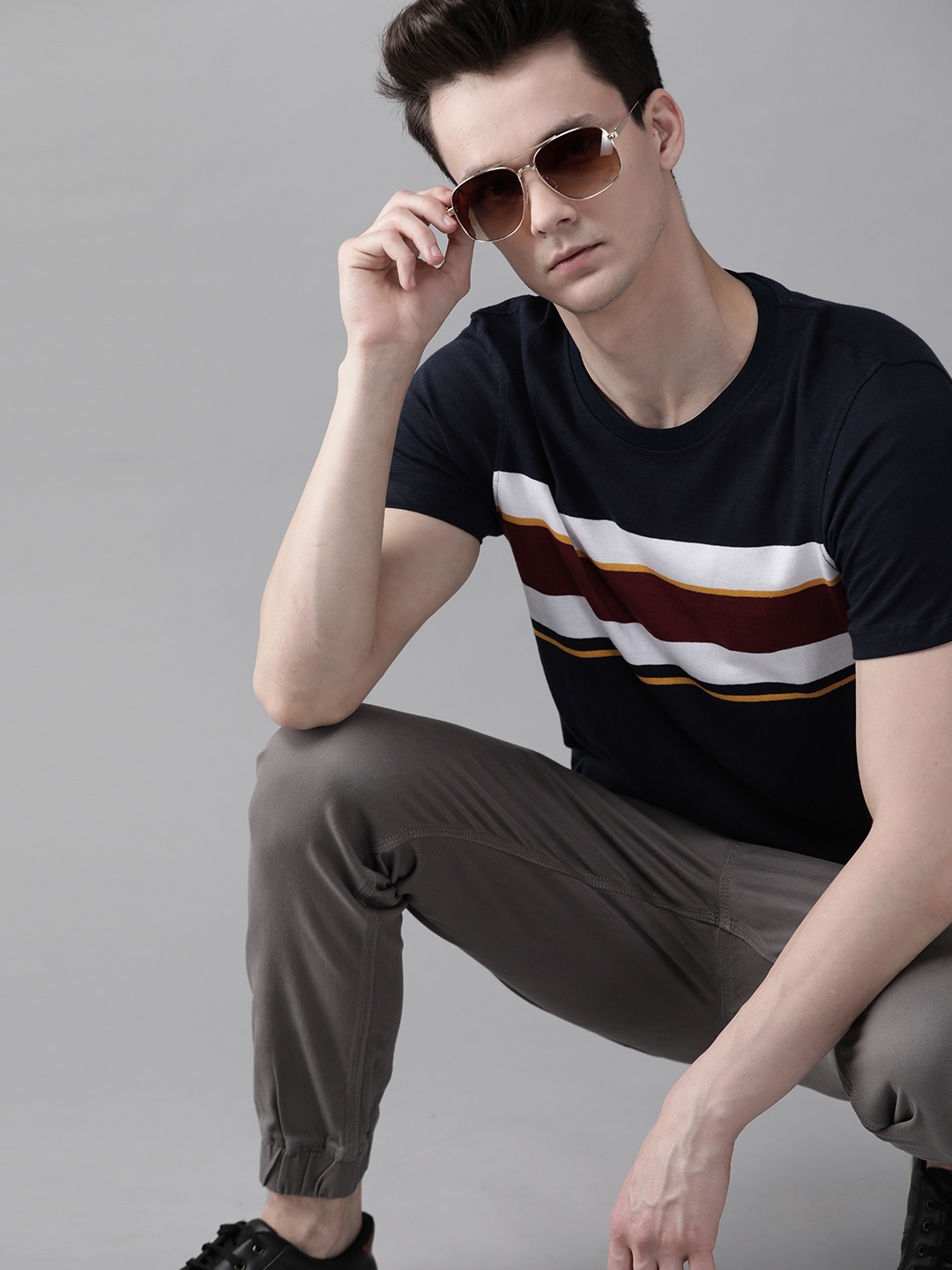 

Roadster Men Navy Blue & White Pure Cotton Striped Round Neck T-shirt