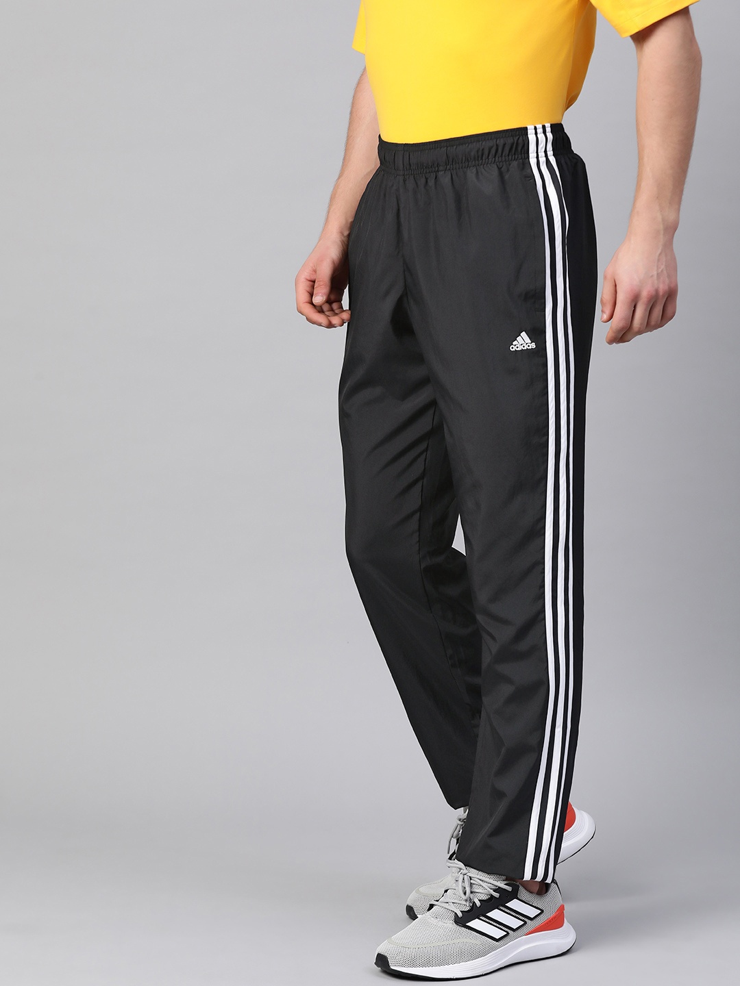 

ADIDAS Men Black Solid Track Pants With Side Stripe