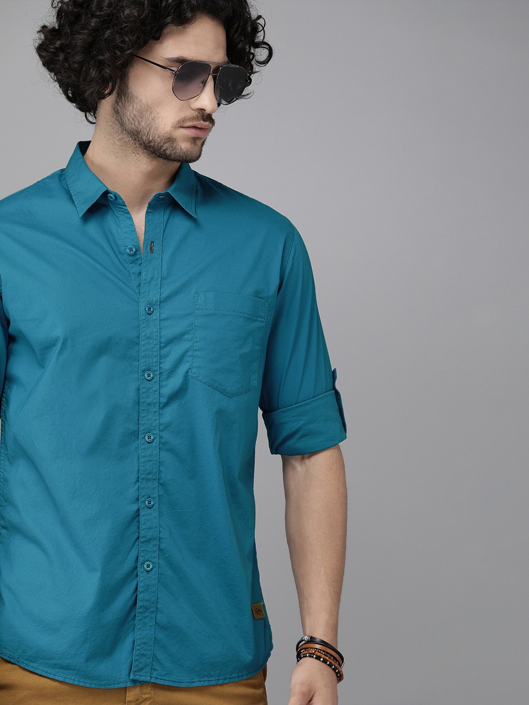 

Roadster Men Teal Blue Slim Fit Solid Casual Stretch Shirt