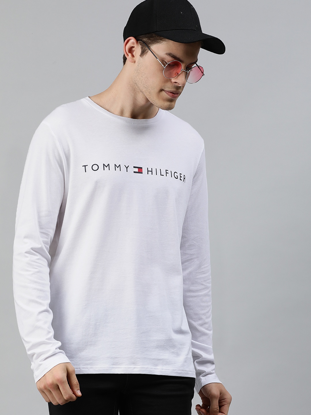 

Tommy Hilfiger Men White Solid Round Neck Pure Cotton T-shirt with Printed Detail