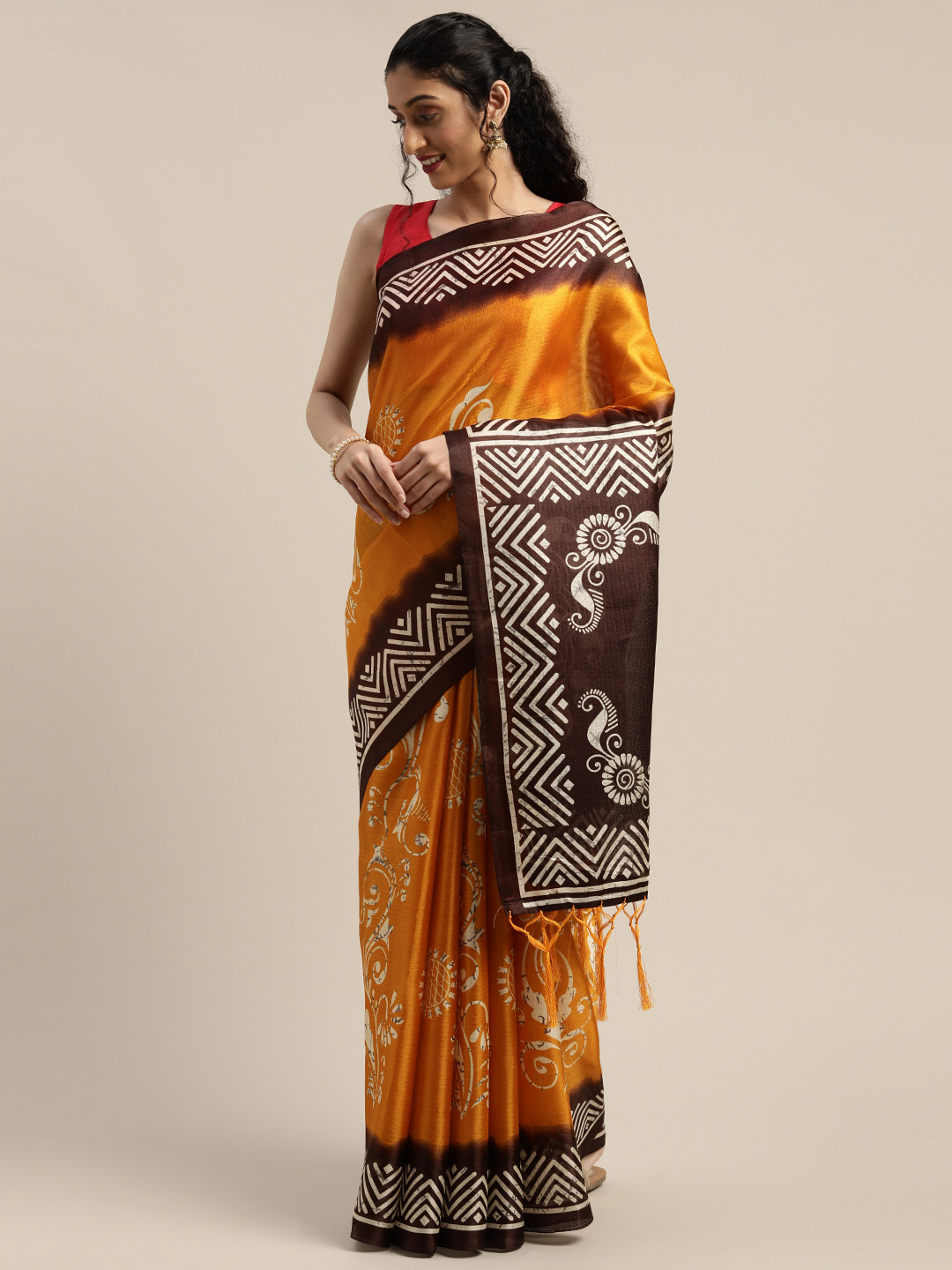 

Rajnandini Yellow & Brown Silk Cotton Printed Saree