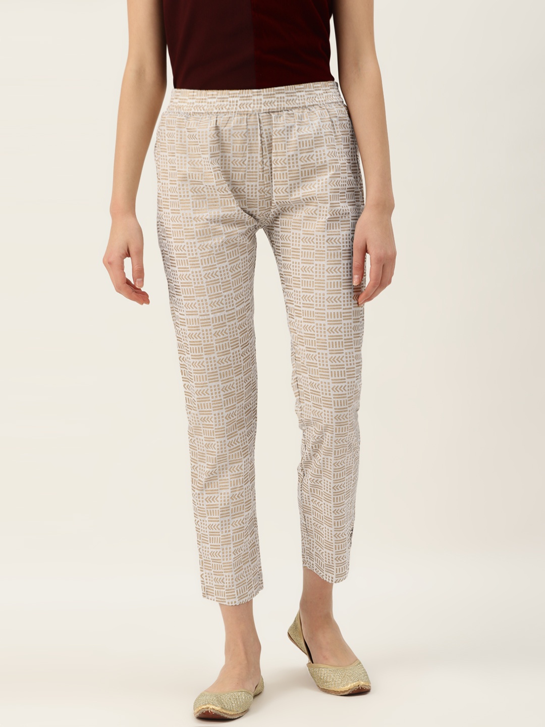 

Varanga Women Off-White & Golden Regular Fit Printed Trousers