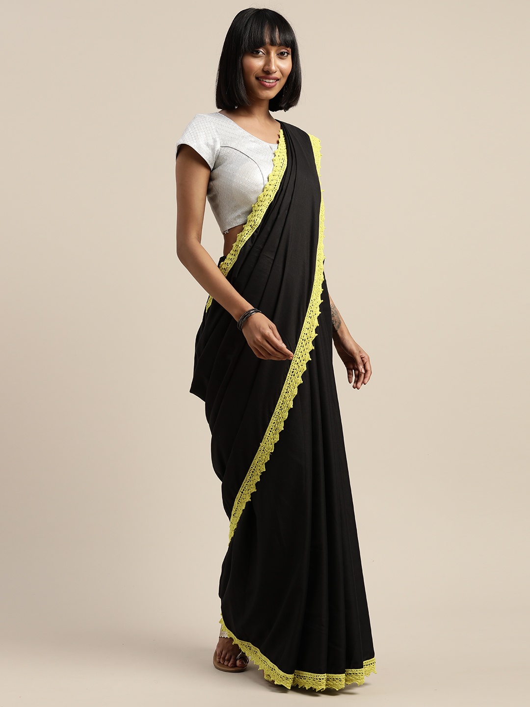 

Mitera Black & Yellow Liva Solid Saree