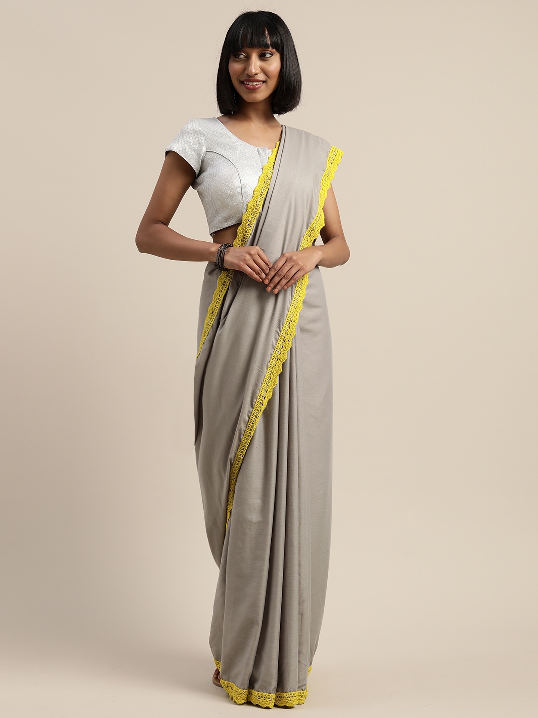 

Mitera Grey & Yellow Liva Solid Saree