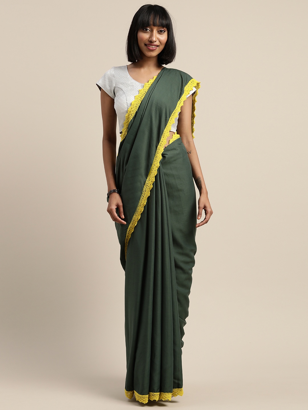 

Mitera Olive Green & Yellow Liva Solid Saree