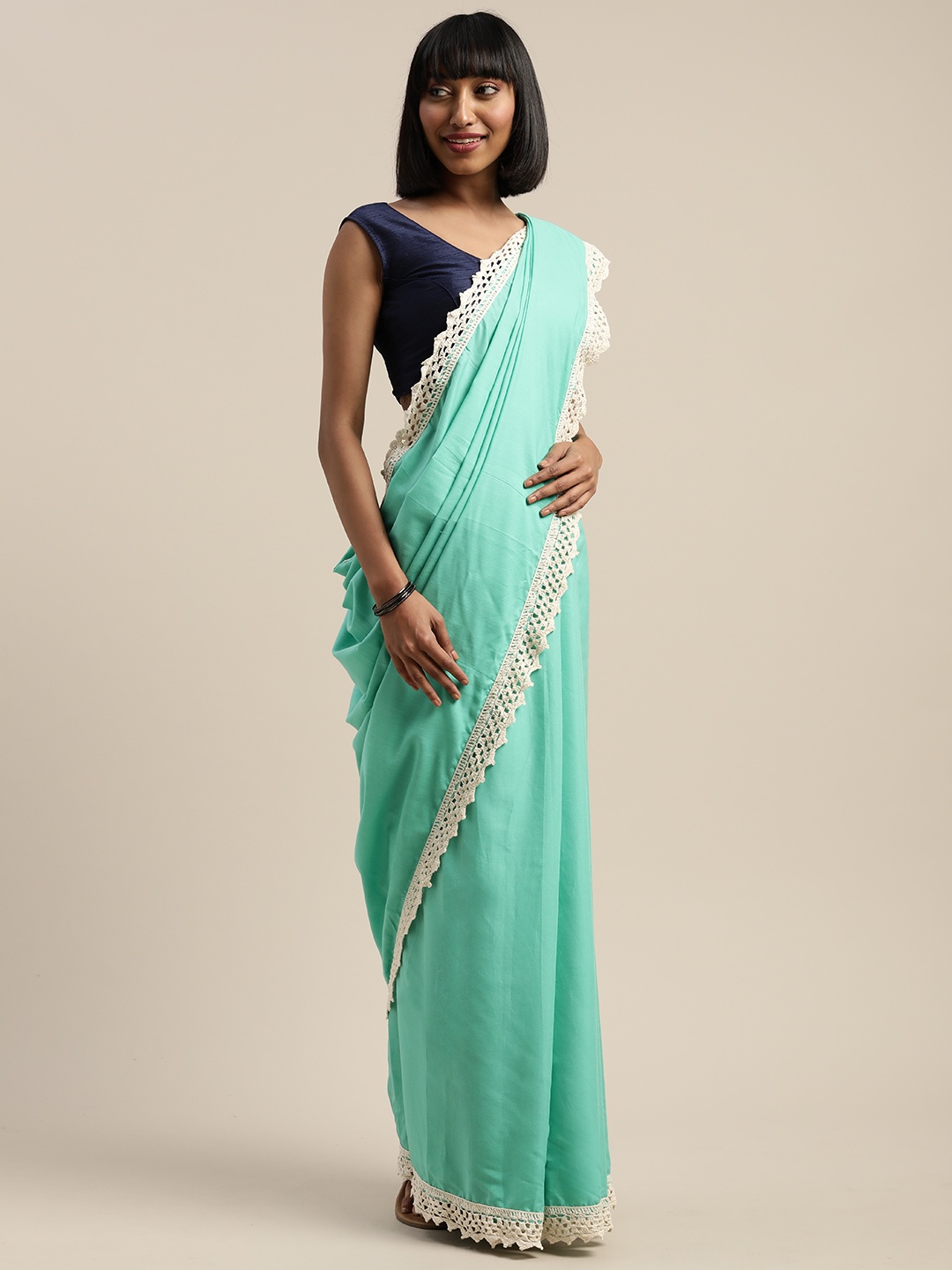 

Mitera Sea Green Solid Liva Saree