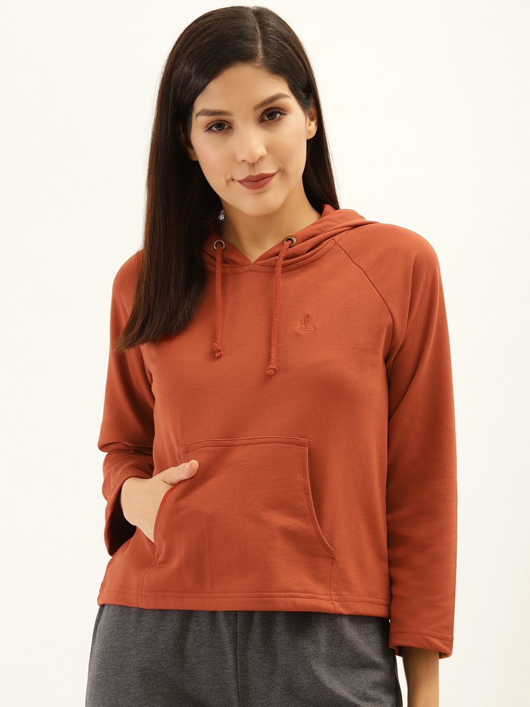 

Laabha Women Rust Brown Solid Hooded Sweatshirt