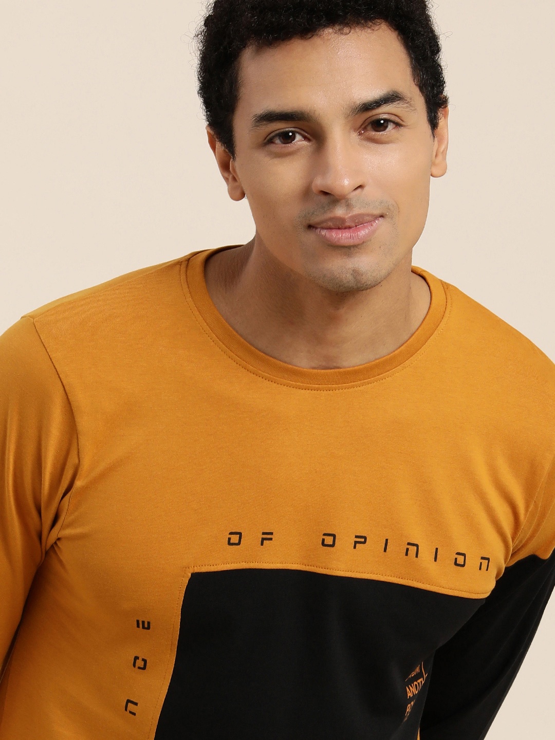 

Difference of Opinion Men Mustard Yellow and Black Colourblocked Round Neck Pure Cotton T-shirt