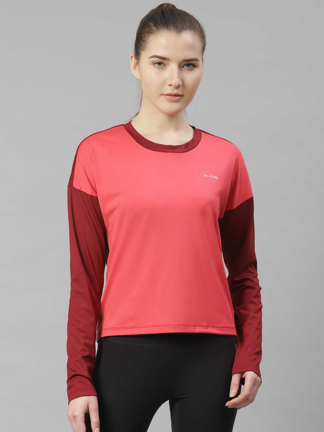 

Alcis Women Coral Pink Solid Slim Fit Round Neck T-shirt