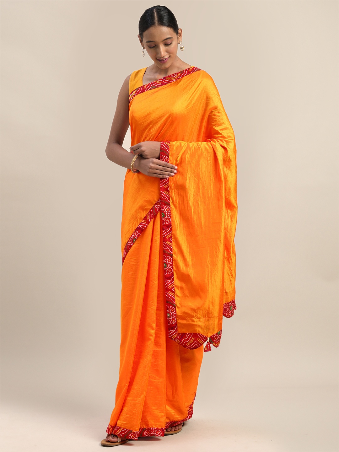 

Mirchi Fashion Orange Silk Blend Solid Bandhani Saree