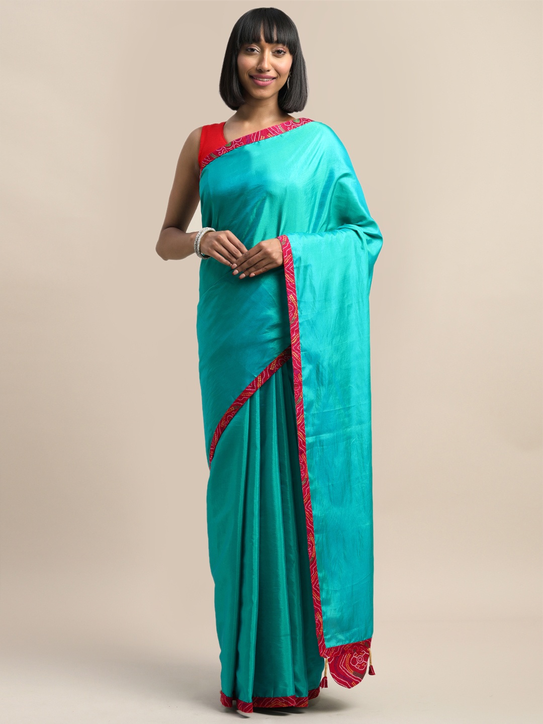 

Mirchi Fashion Turquoise Blue Silk Blend Solid Bandhani Saree