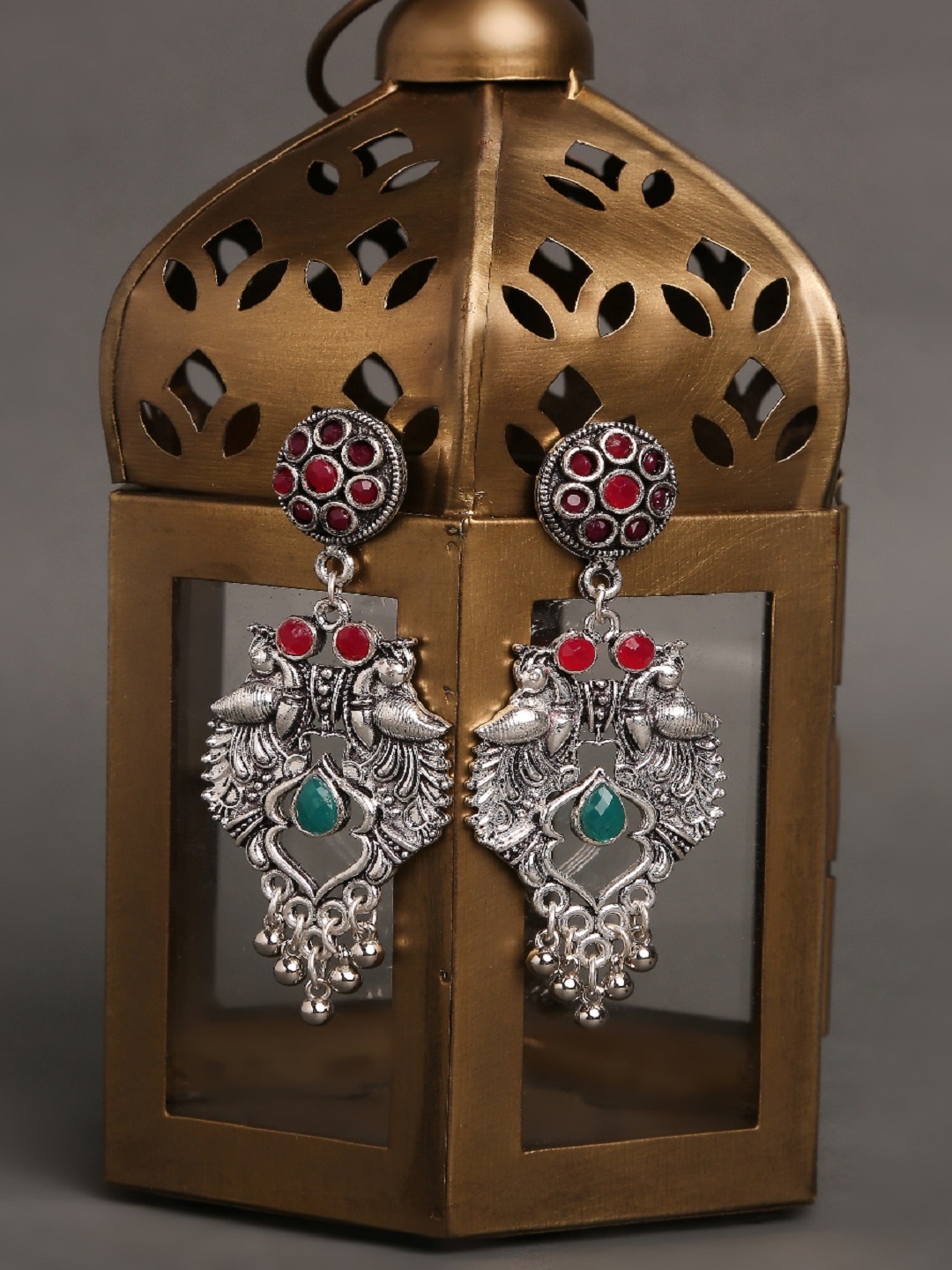 

OOMPH Silver-Toned & Green Oxidised Peacock Shaped Drop Earrings