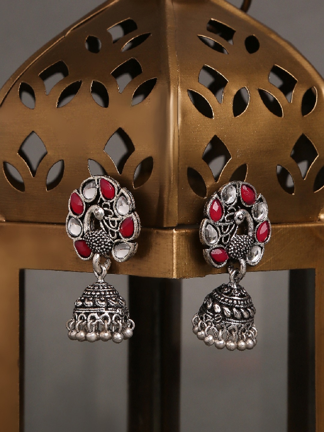 

OOMPH Silver-Toned & Maroon Oxidised Peacock Shaped Jhumkas