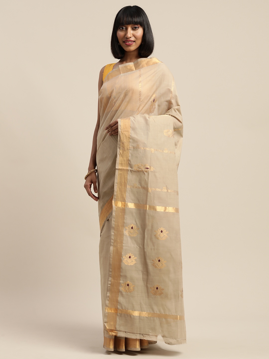 

APCO Beige with a tinge of Brown Solid Pure Cotton Saree with Woven Design Details